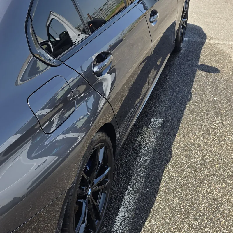 Grey BMW 3 Series with a mirror gloss finish after a full exterior detail