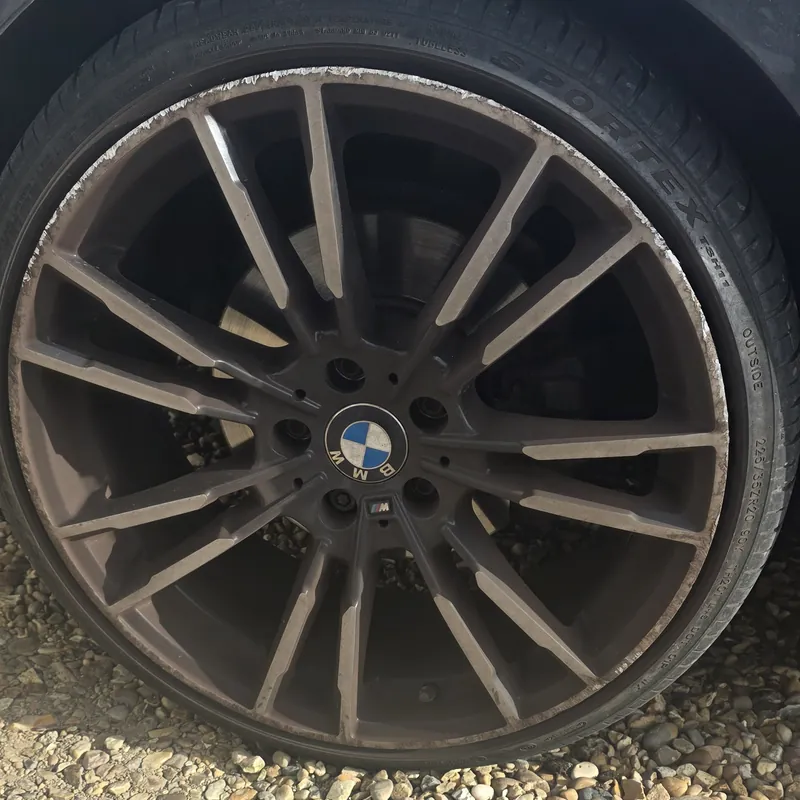 BMW M Sport alloy caked in brake dust before a deep wheel clean in Wembley