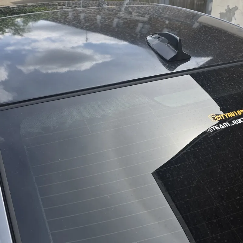 BMW roof and rear glass coated in dirt before a decontamination wash