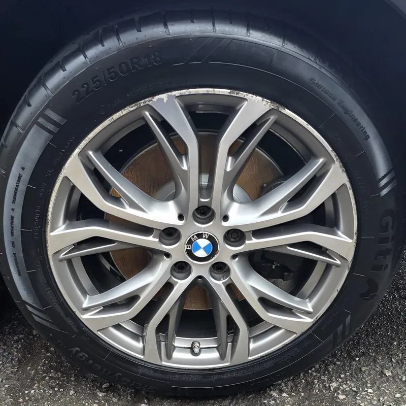The same BMW X1 alloy gleaming after a deep clean and decontamination