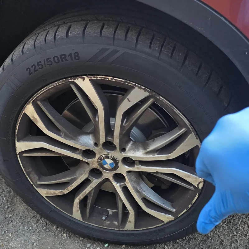 BMW X1 alloy wheel caked in brake dust before a deep wheel clean in Wembley