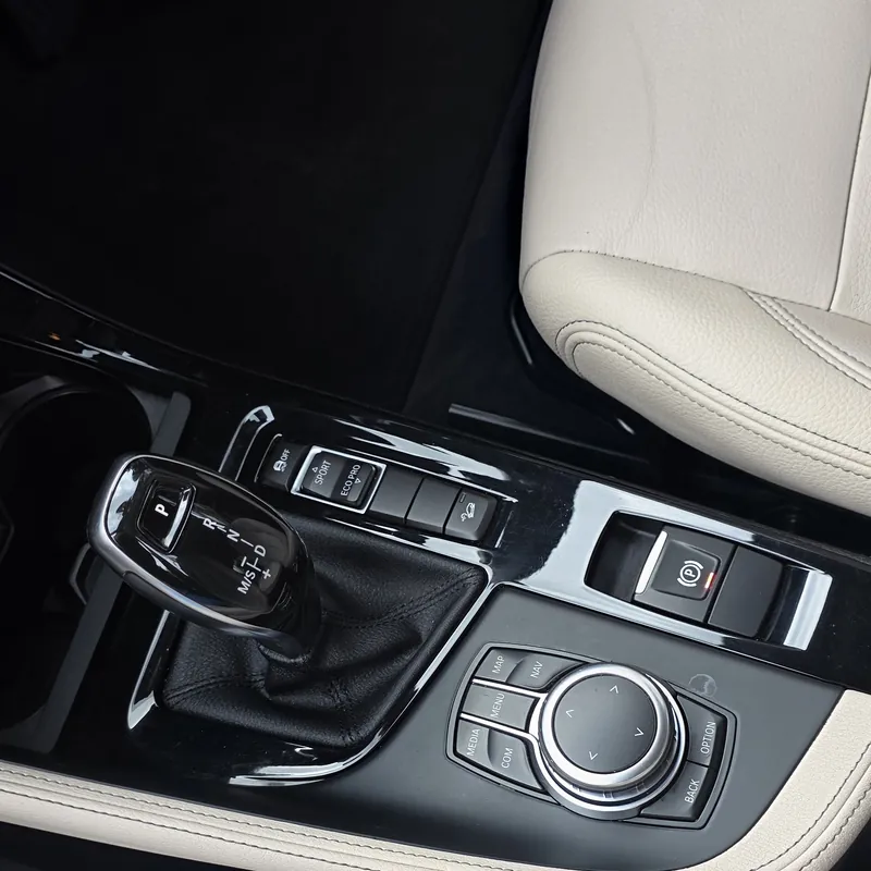 Spotless gloss black console after an interior detail in Wembley