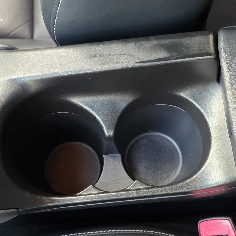 Spotless cup holders after an interior deep clean by PureShine Detailing