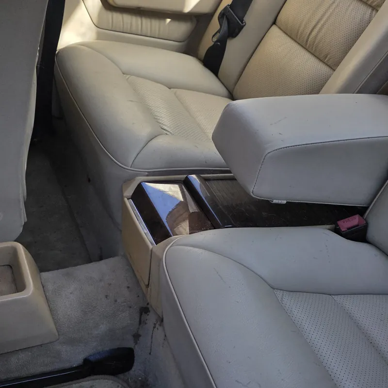 Dusty cream leather and dirty carpets in a classic Mercedes before an interior valet