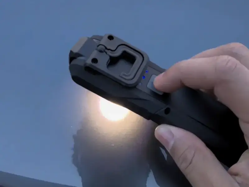 Torch inspection checking paint for swirls during car detailing